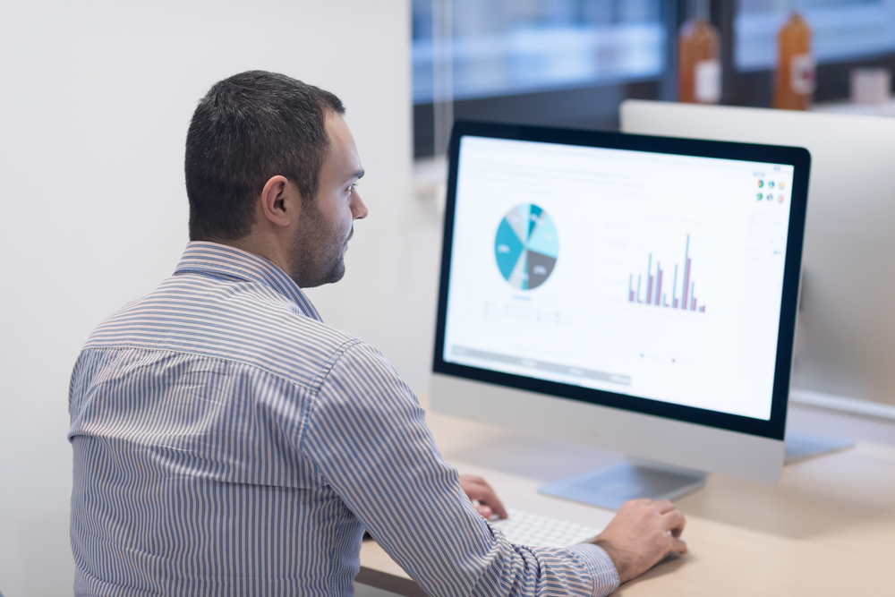 startup business, software developer working on desktop computer at modern office